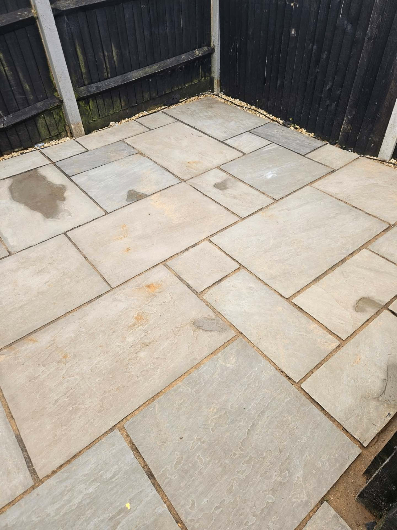 Rear Indian sandstone patio jet washed back to a uniform natural finish in a South Hampshire garden