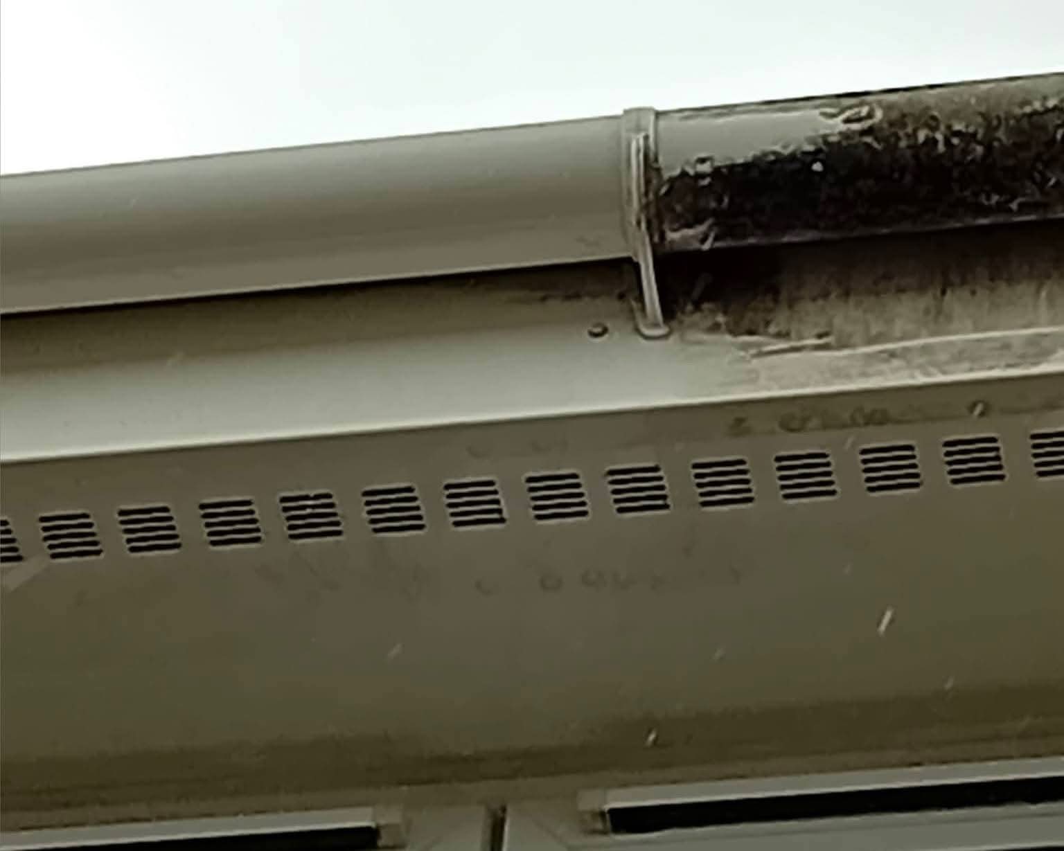 External gutter and fascia clean showing tiger-stripe removal