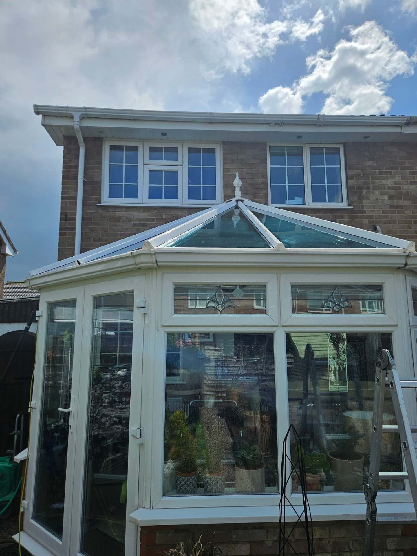 Restored conservatory glass roof after full panel, bar and finial hand clean
