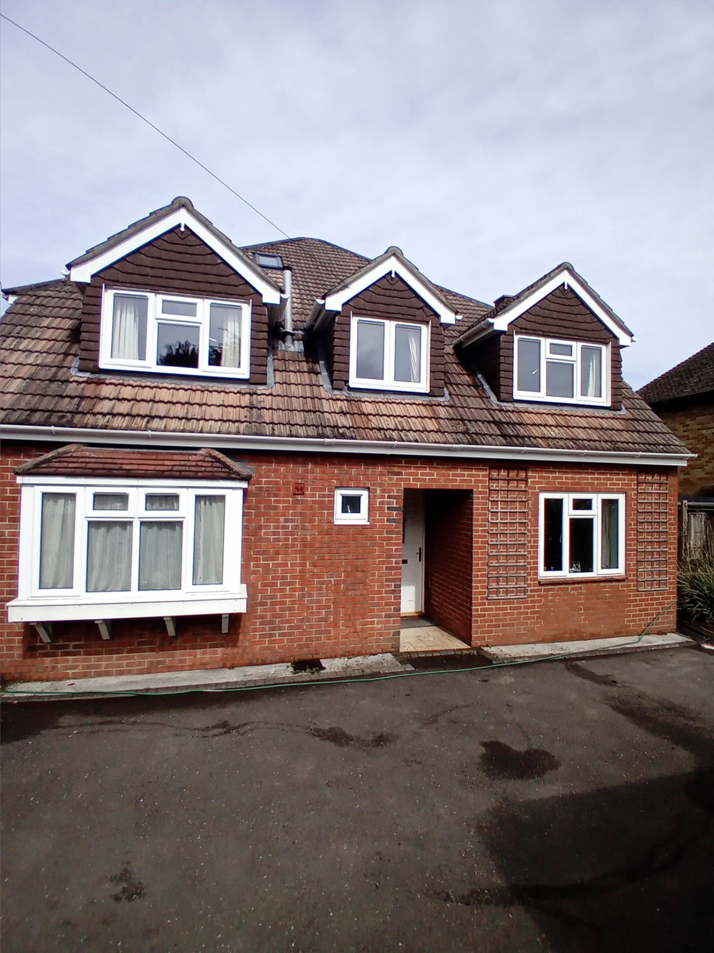 Full front elevation after fascia, soffit and gutter cleaning on a South Hampshire home